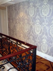 stenciled blue damask wall